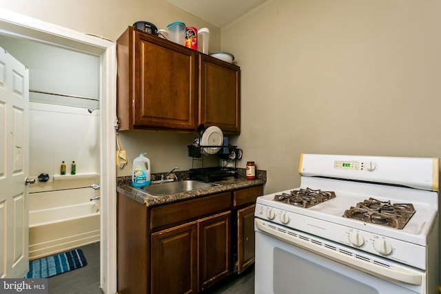 kitchen with sink and white gas stove