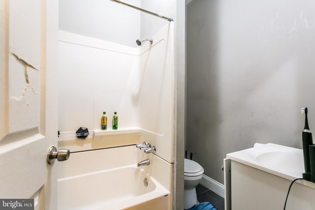 full bathroom with tile patterned floors, toilet, vanity, and shower / washtub combination