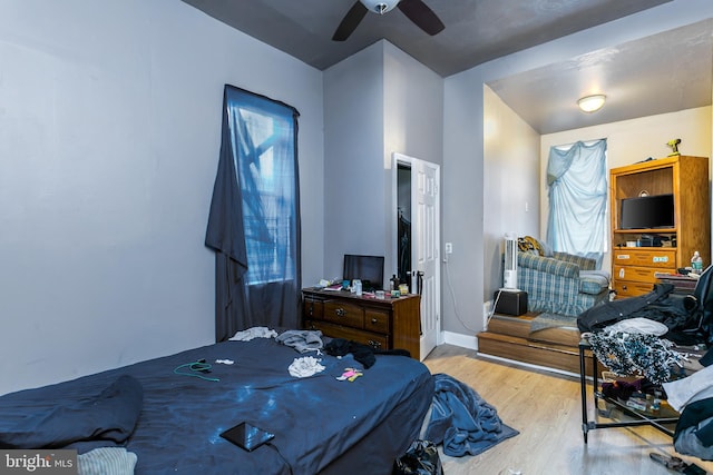 bedroom featuring ceiling fan and light wood-type flooring