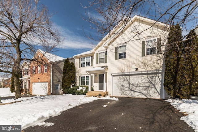 front of property with a garage