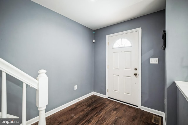 entryway with dark hardwood / wood-style floors