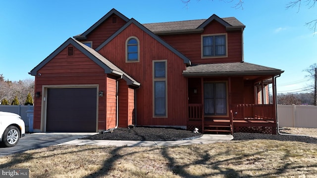 view of front of home featuring a garage and a porch