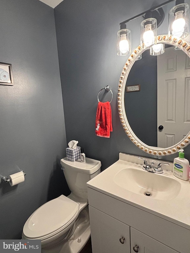 bathroom with vanity and toilet