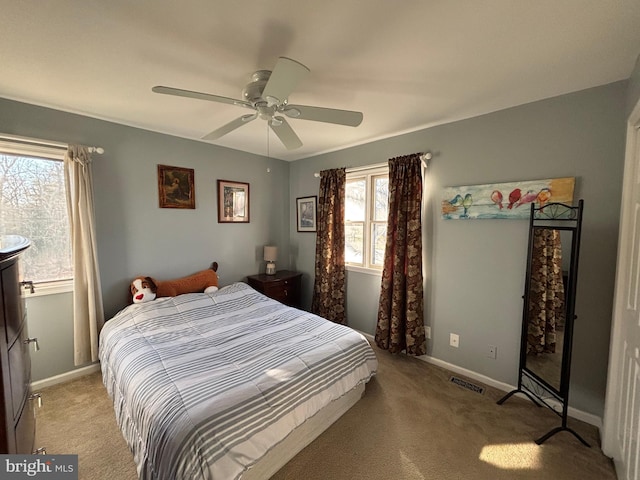 carpeted bedroom with ceiling fan