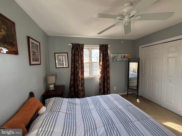 carpeted bedroom with a closet and ceiling fan