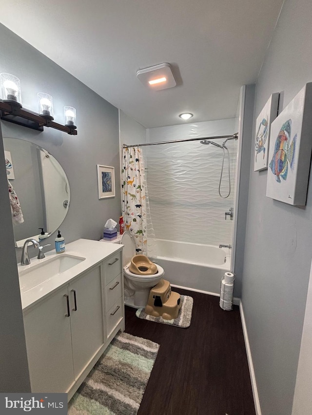 full bathroom with hardwood / wood-style flooring, vanity, toilet, and shower / bath combo