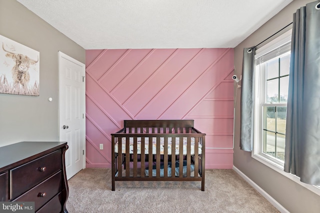 carpeted bedroom with a textured ceiling