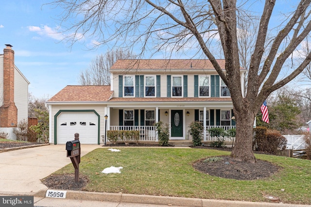 view of front facade featuring a porch, an attached garage, fence, driveway, and a front lawn