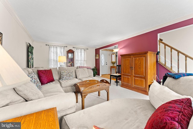 carpeted living room with ornamental molding and stairs