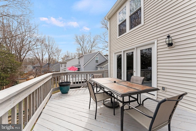 wooden terrace featuring outdoor dining space