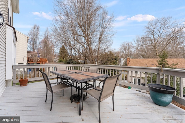 wooden deck with outdoor dining area