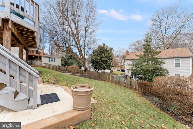 view of yard featuring a residential view, a patio area, and fence