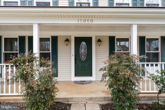 entrance to property with covered porch