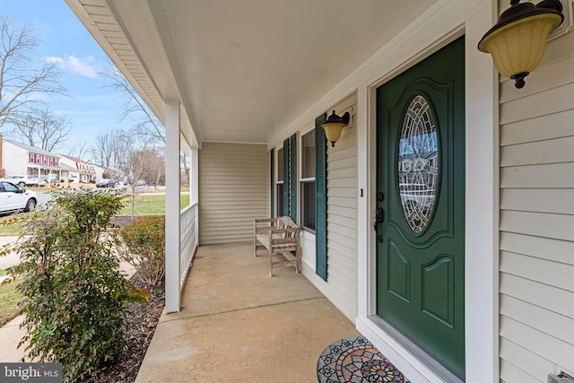 entrance to property featuring covered porch