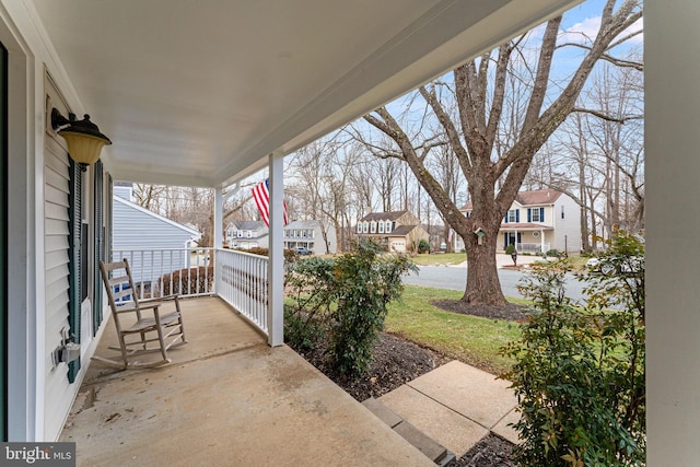 view of patio featuring a porch and a residential view