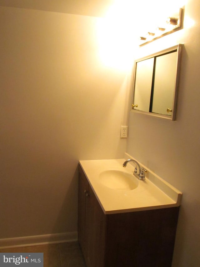 bathroom featuring tile patterned flooring and vanity