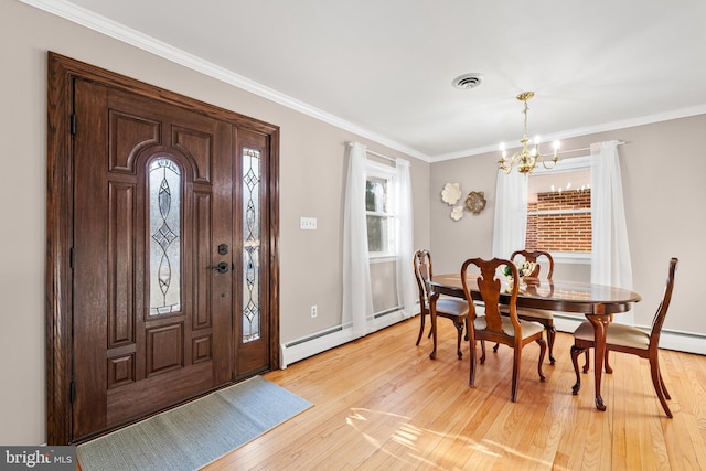 entrance foyer featuring light wood-style floors, a baseboard radiator, visible vents, and crown molding