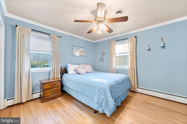 bedroom with light wood-style flooring, multiple windows, visible vents, and crown molding