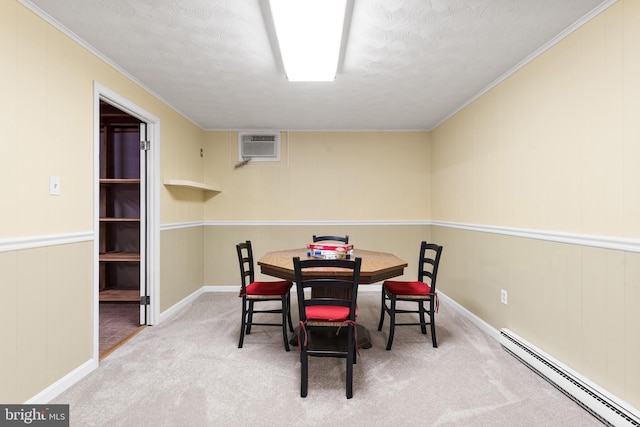 carpeted dining room featuring ornamental molding, a baseboard radiator, and a wall unit AC