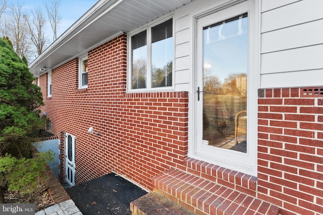 view of property exterior featuring brick siding