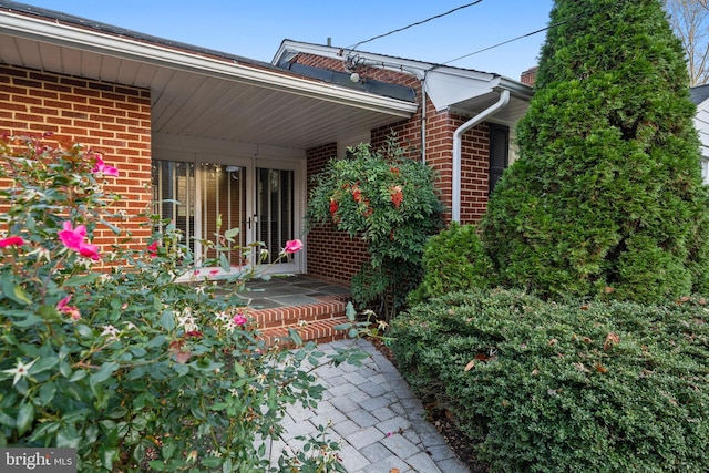 exterior space with brick siding