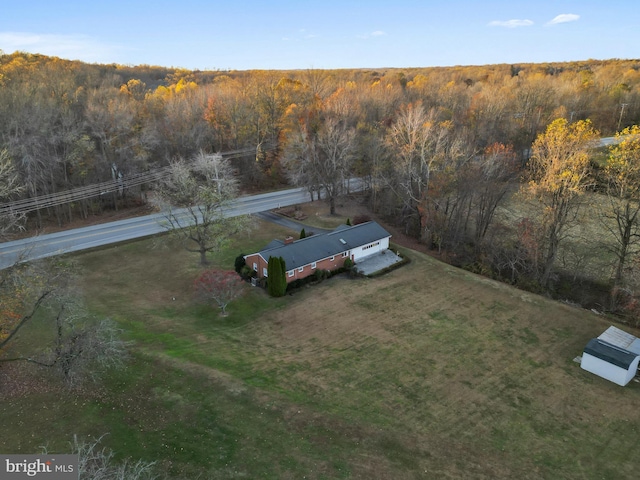 drone / aerial view with a view of trees