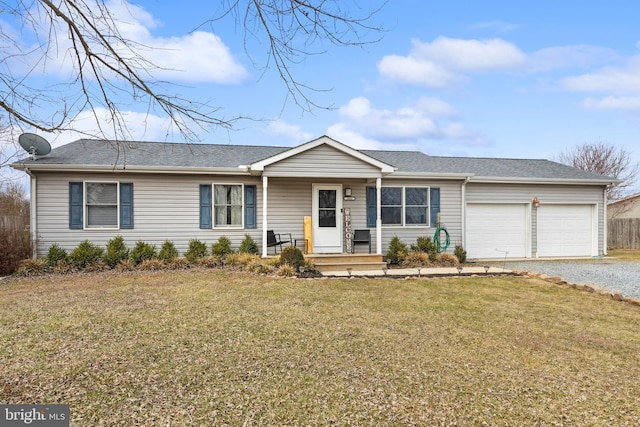 single story home featuring driveway, a shingled roof, an attached garage, and a front yard