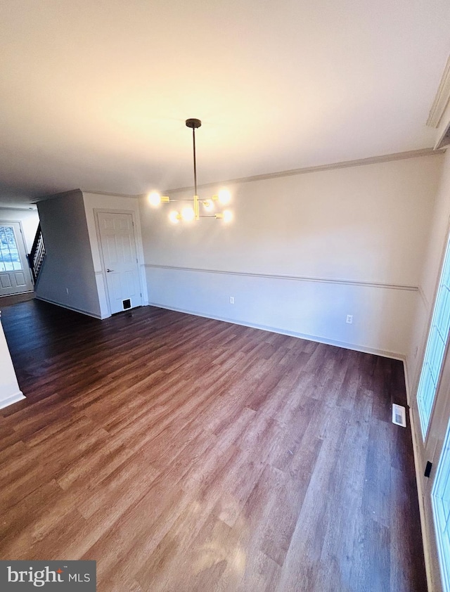 unfurnished dining area with dark hardwood / wood-style floors