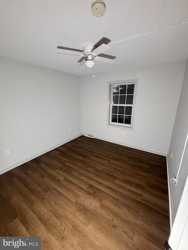 empty room featuring hardwood / wood-style flooring and ceiling fan