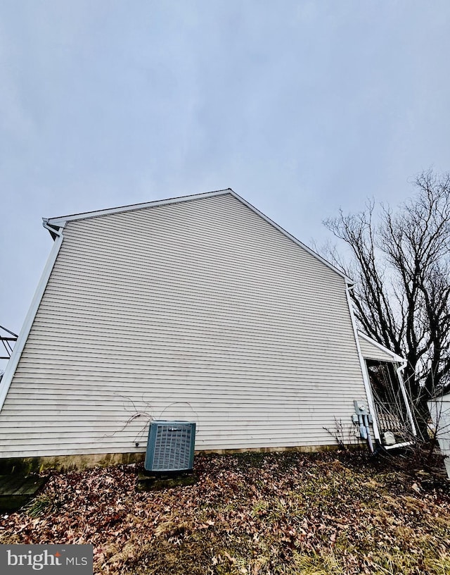 view of side of property featuring central AC unit