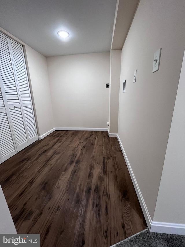 hall with dark hardwood / wood-style floors