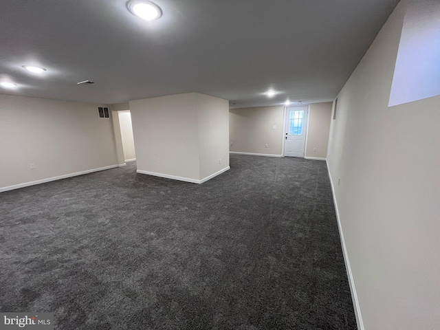 basement with dark carpet