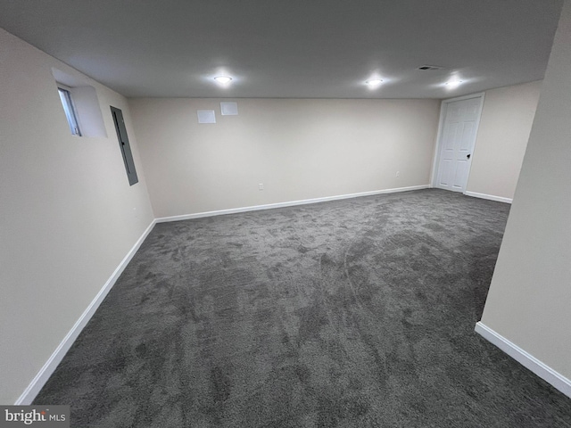 basement featuring dark colored carpet