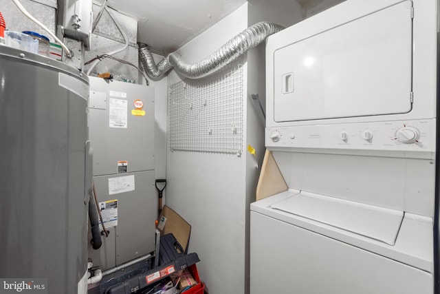 washroom with stacked washer and dryer and laundry area