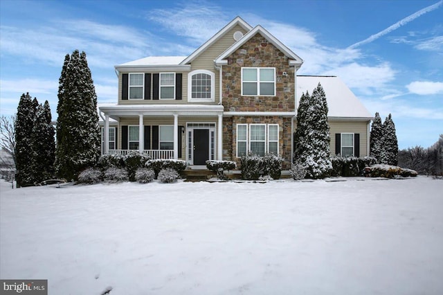 view of front of house featuring covered porch and stone siding