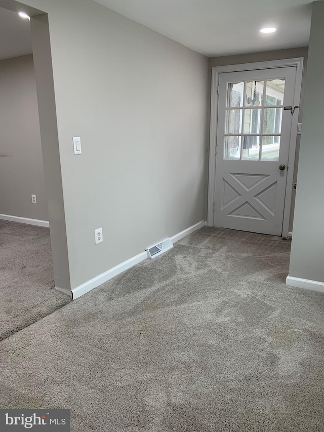 interior space featuring carpet, visible vents, baseboards, and recessed lighting