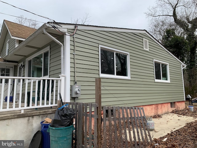 view of home's exterior with fence