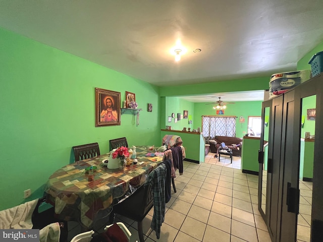 dining room with ceiling fan and light tile patterned floors