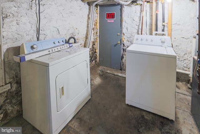 clothes washing area featuring washer and dryer