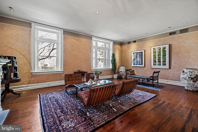 interior space with a wealth of natural light, visible vents, baseboards, and hardwood / wood-style floors