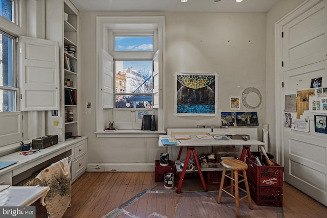 office space with wood-type flooring and baseboards