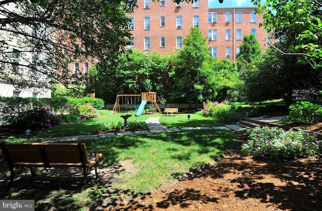 view of yard featuring playground community