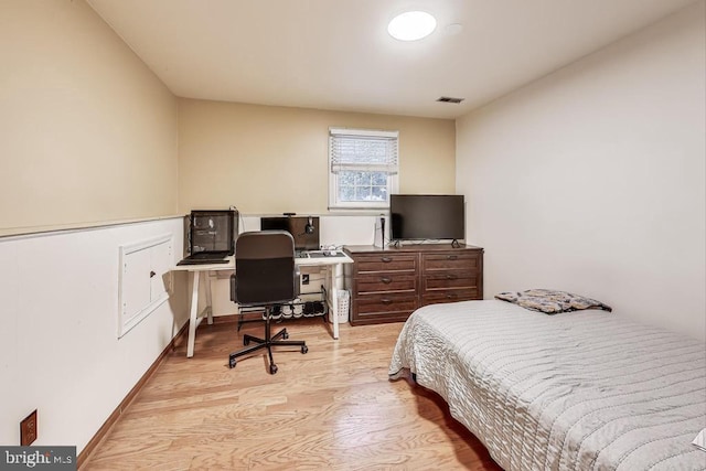 bedroom featuring light wood-type flooring and visible vents