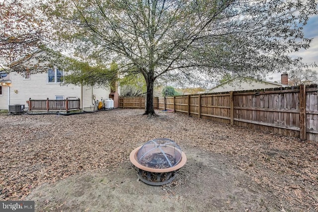 view of yard featuring an outdoor fire pit and a fenced backyard