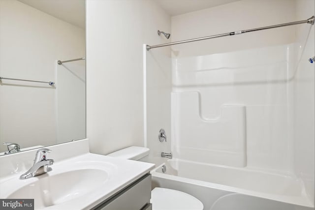 full bathroom with washtub / shower combination, vanity, and toilet