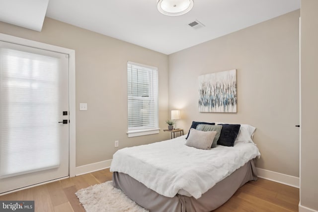 bedroom with light hardwood / wood-style floors