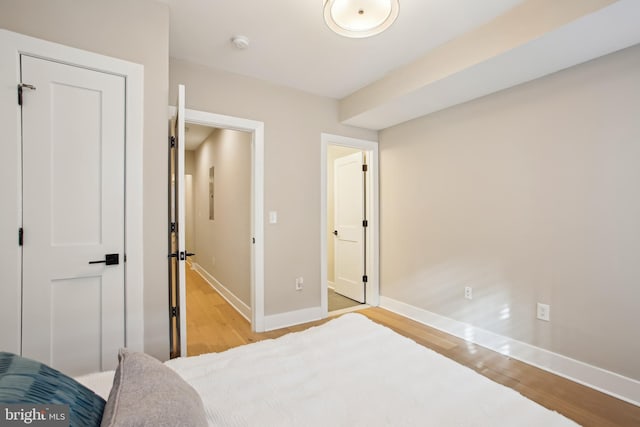 bedroom with light hardwood / wood-style flooring