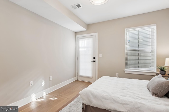 bedroom with light hardwood / wood-style floors