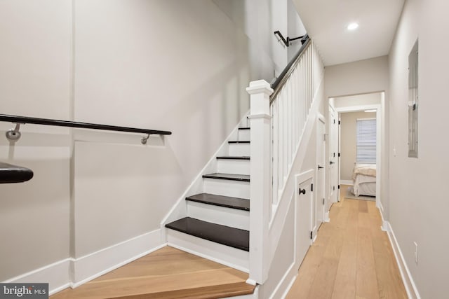 staircase featuring hardwood / wood-style flooring