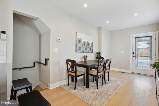 dining area with light hardwood / wood-style flooring